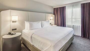 Premium bedding, desk, laptop workspace, iron/ironing board