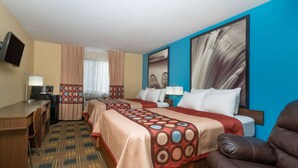 A hotel room with two beds, a desk, a TV, and a large window with curtains. - Super 8 by Wyndham Rochester Mayo Clinic Area (Rochester)