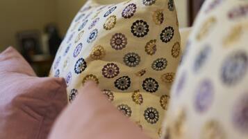 A close-up of a pillow with a floral pattern.