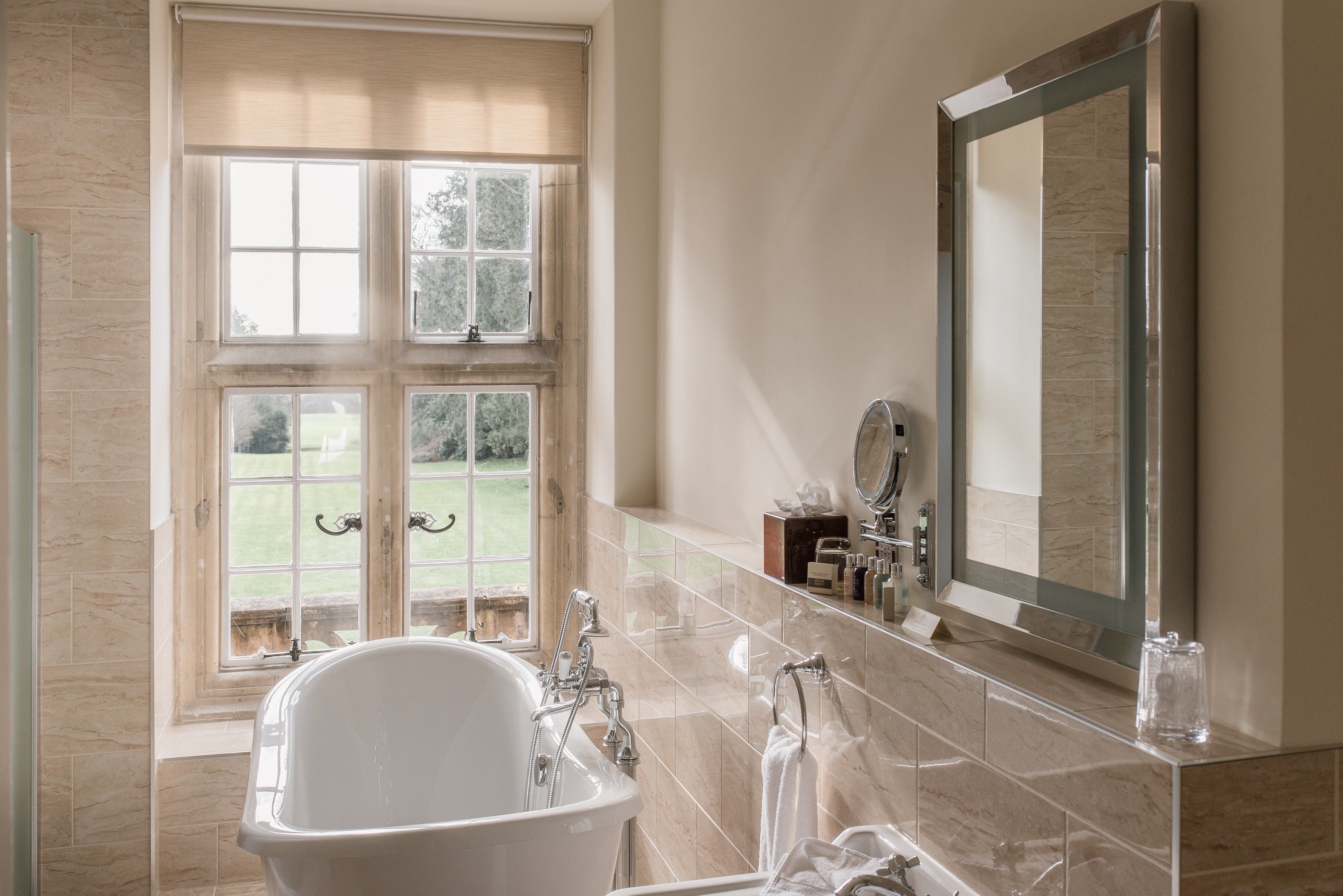 combined shower/bathtub, designer toiletries, hair dryer, bathrobes