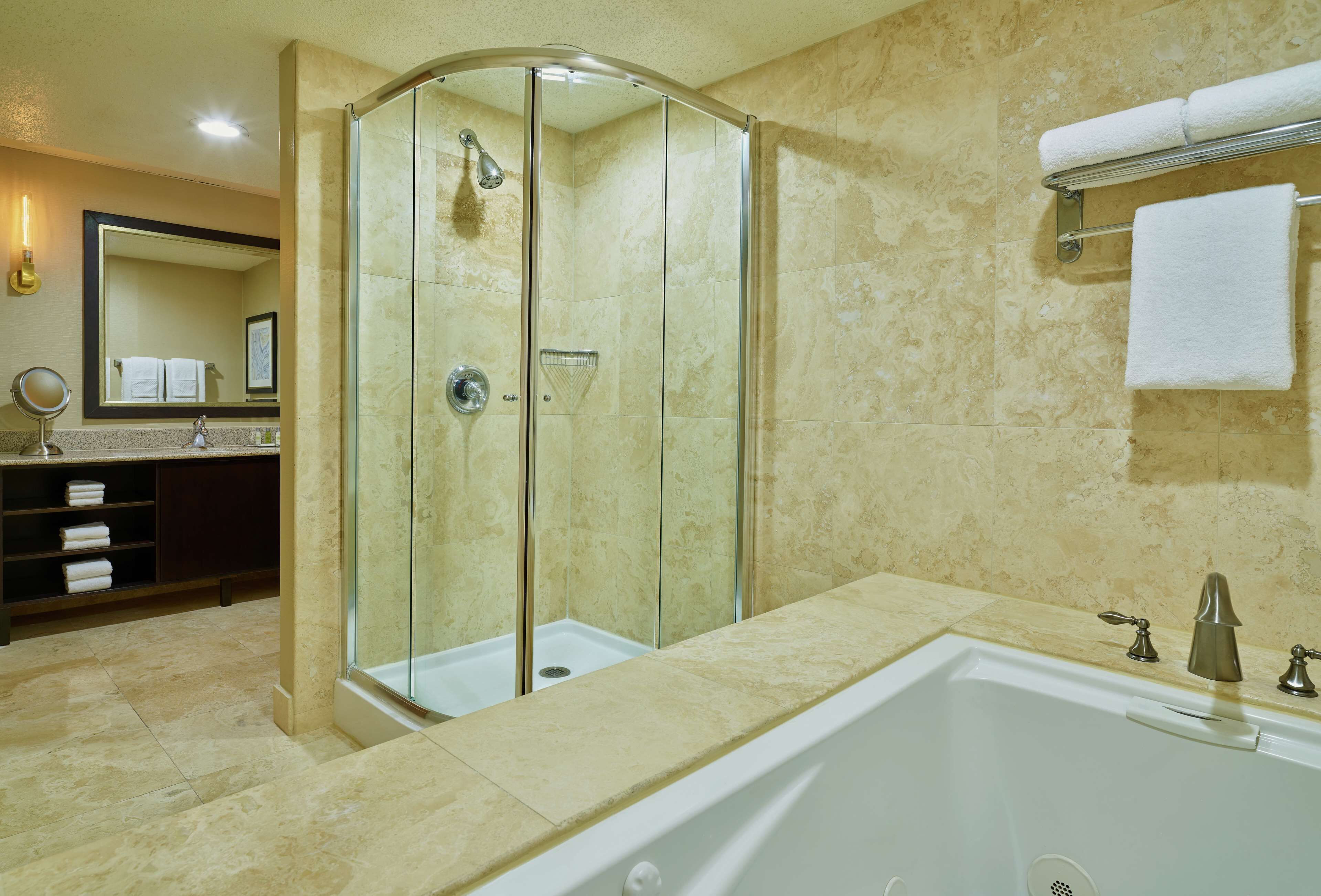 presidential suite, 1 king bed, non smoking | bathroom | combined shower/bathtub, free toiletries, hair dryer, towels