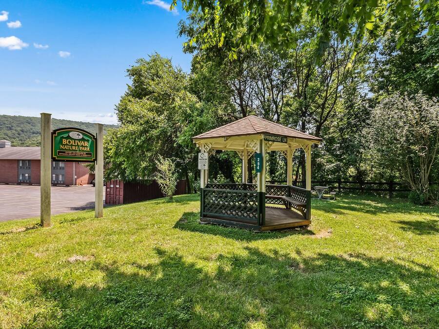 A gazebo in a park with a sign for Bolivar Nature Park.