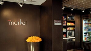 A modern interior with a vending machine and a microwave. - Courtyard by Marriott Norwalk (Norwalk)
