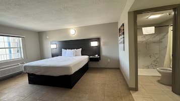 Room, 1 King Bed, Non Smoking | Desk, blackout drapes, iron/ironing board, rollaway beds