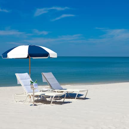 Private beach, white sand, sun loungers, beach umbrellas