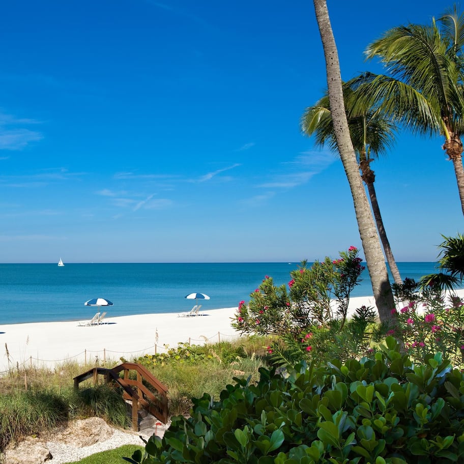 Private beach, white sand, sun loungers, beach umbrellas
