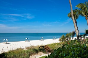 Private beach, white sand, sun loungers, beach umbrellas
