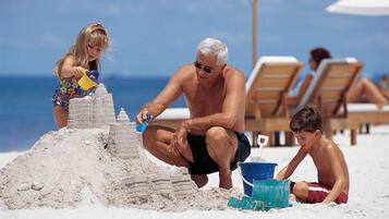Private beach, white sand, sun loungers, beach umbrellas