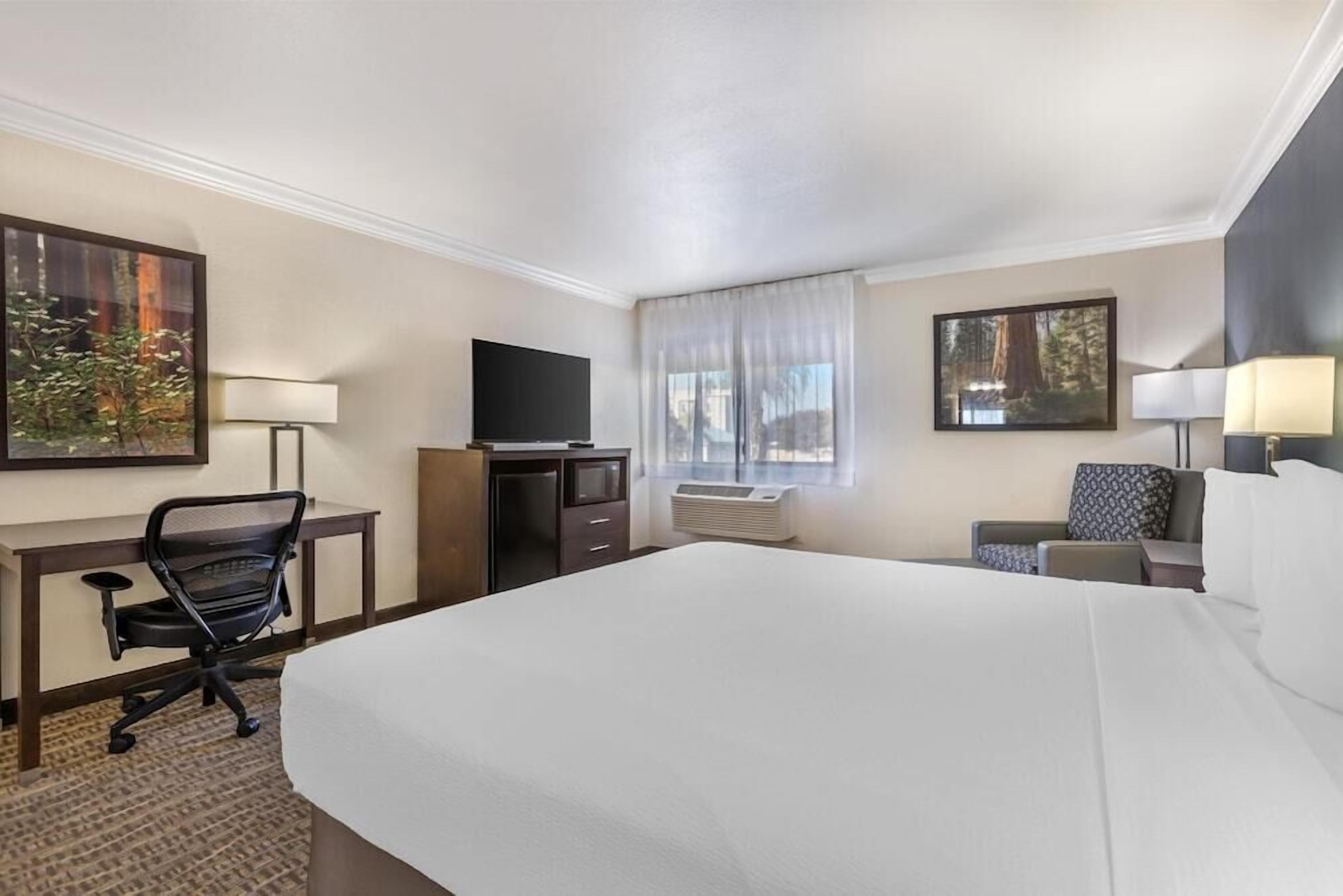 Premium bedding, desk, laptop workspace, iron/ironing board