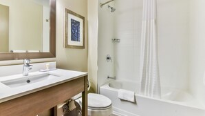 A bathroom with a sink, toilet, and bathtub. - Comfort Hotel Airport North (Toronto)