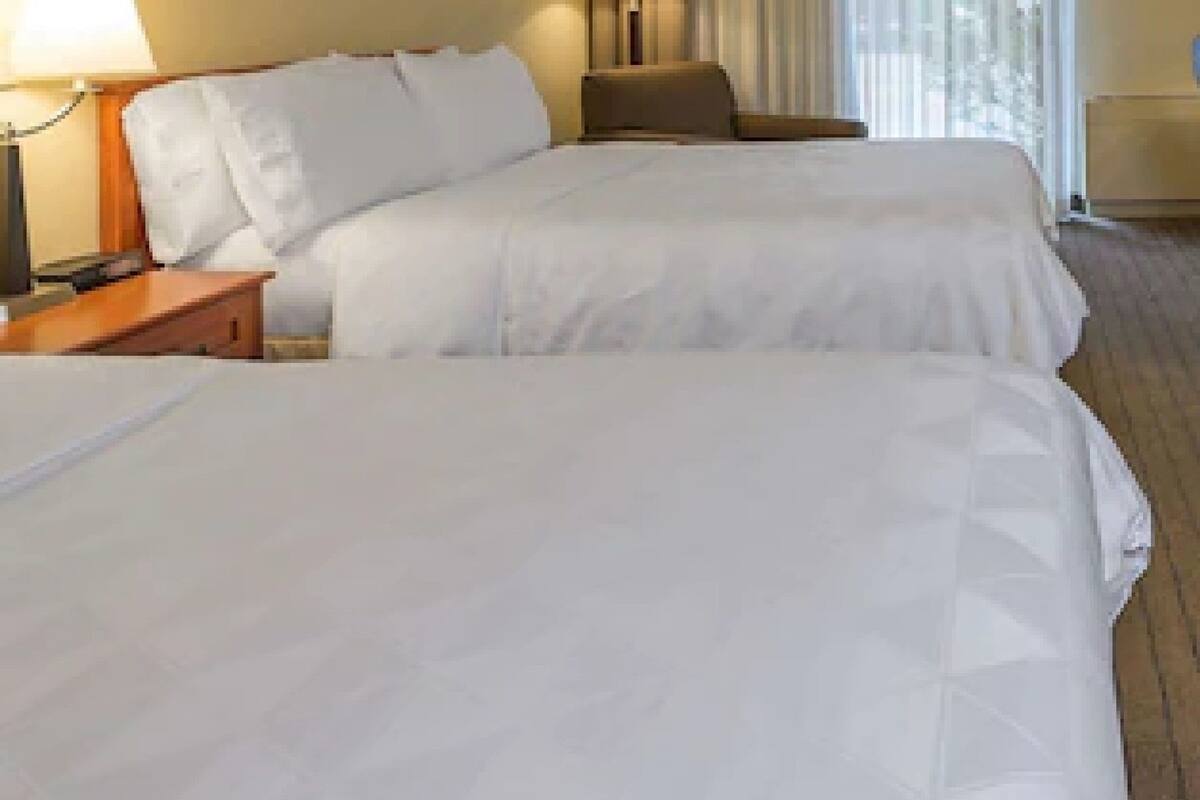 Premium bedding, pillowtop beds, desk, blackout drapes