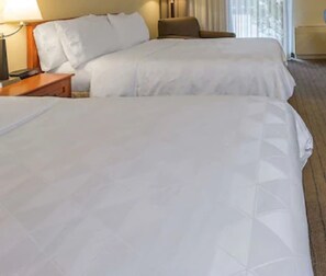 Premium bedding, pillow-top beds, desk, blackout curtains