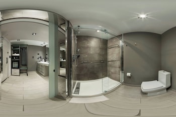 Eco-friendly toiletries, hair dryer, bathrobes, towels at AC Hotel by Marriott San Juan Condado