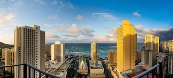 Hotel room view looking out at Hilton Waikiki Beach