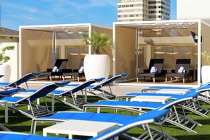 Outdoor pool, open 7:00 AM to 10:00 PM, cabanas (surcharge)