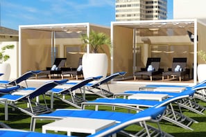 Outdoor pool, open 7:00 AM to 10:00 PM, cabanas (surcharge)
