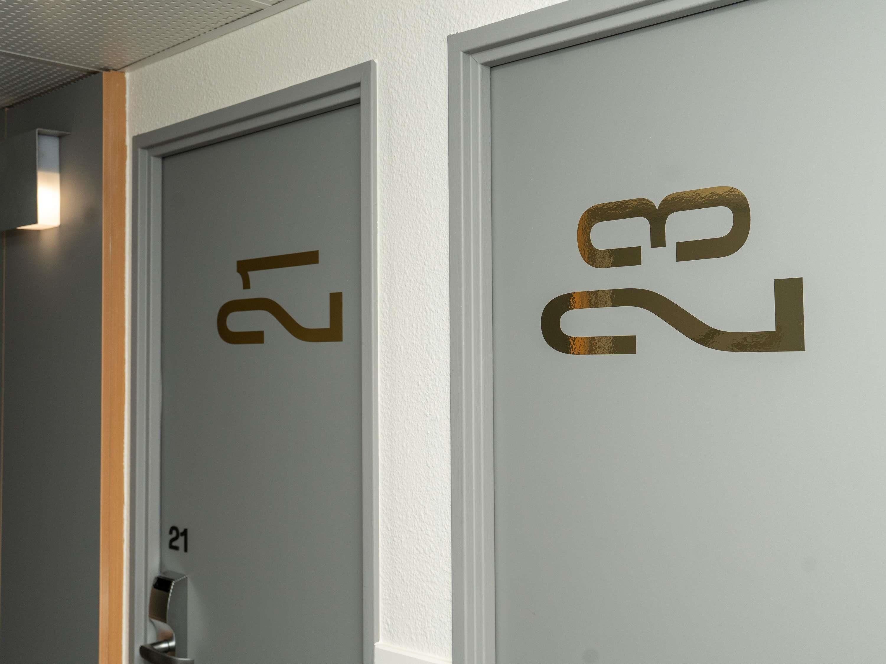 Two doors with numbers 21 and 22, indicating room numbers in a hotel.