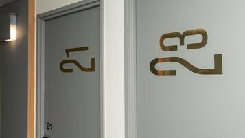 Two doors with numbers 21 and 22, indicating room numbers in a hotel.