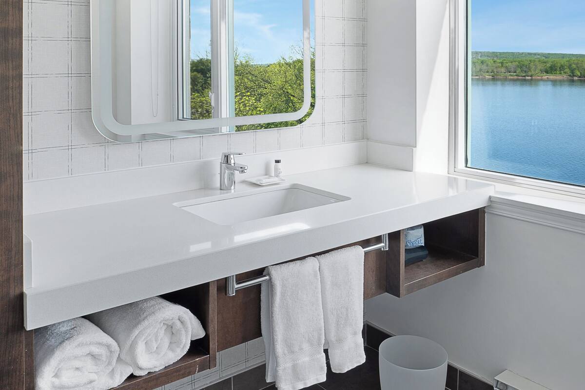 junior suite, 1 king bed with sofa bed, river view | bathroom | combined shower/bathtub, free toiletries, hair dryer, towels