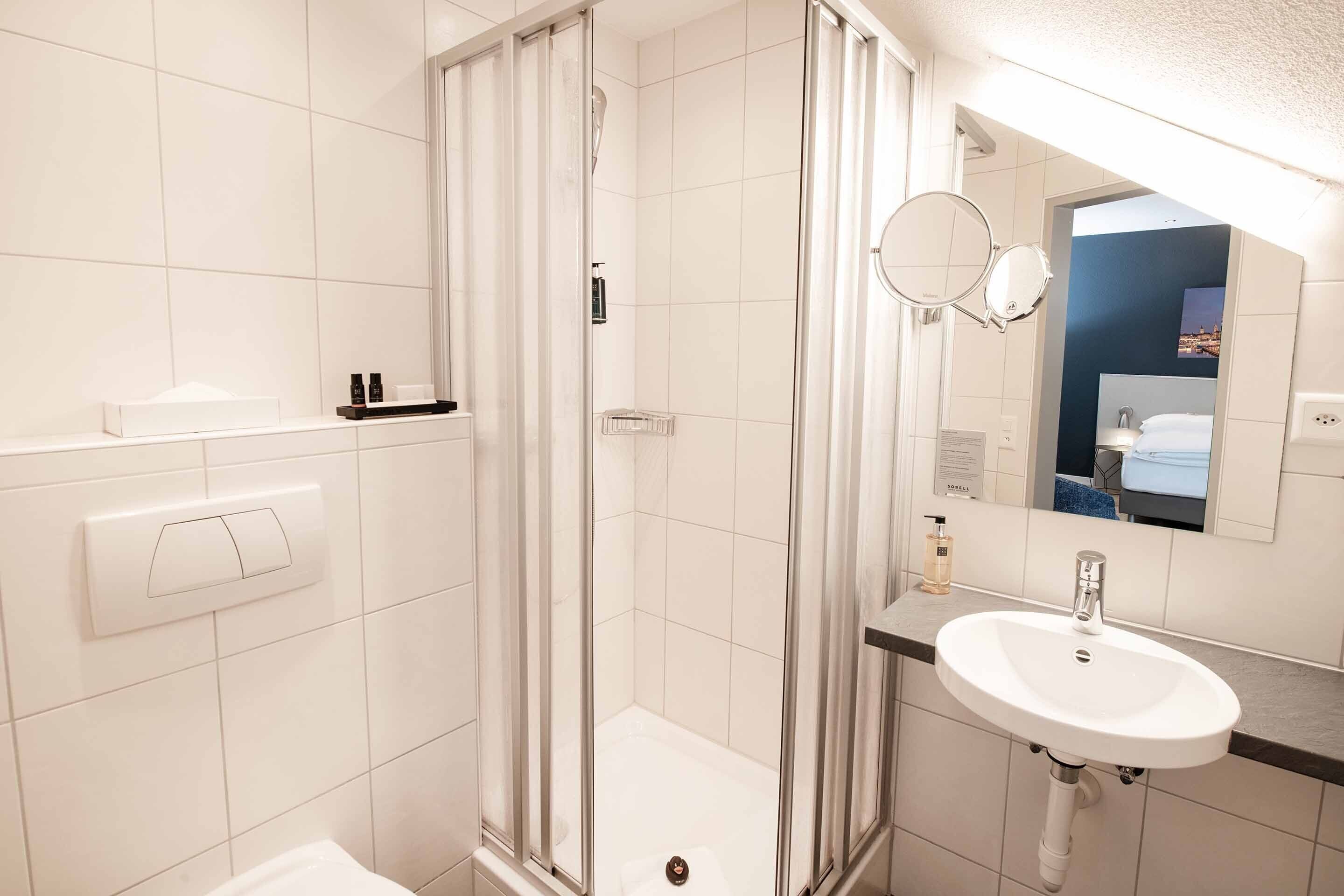 eco-friendly toiletries, hair dryer, towels