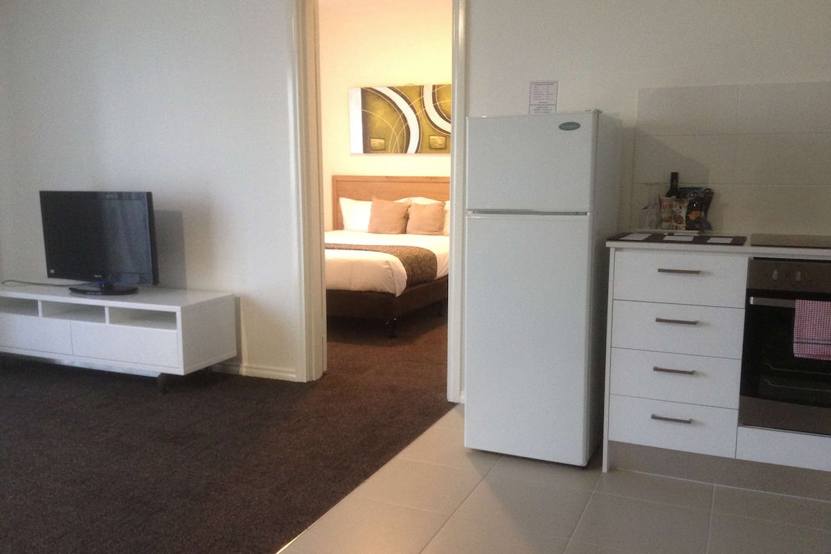 standard apartment, 1 queen bed, non smoking, balcony (living room) | desk, blackout curtains, soundproofing, iron/ironing board