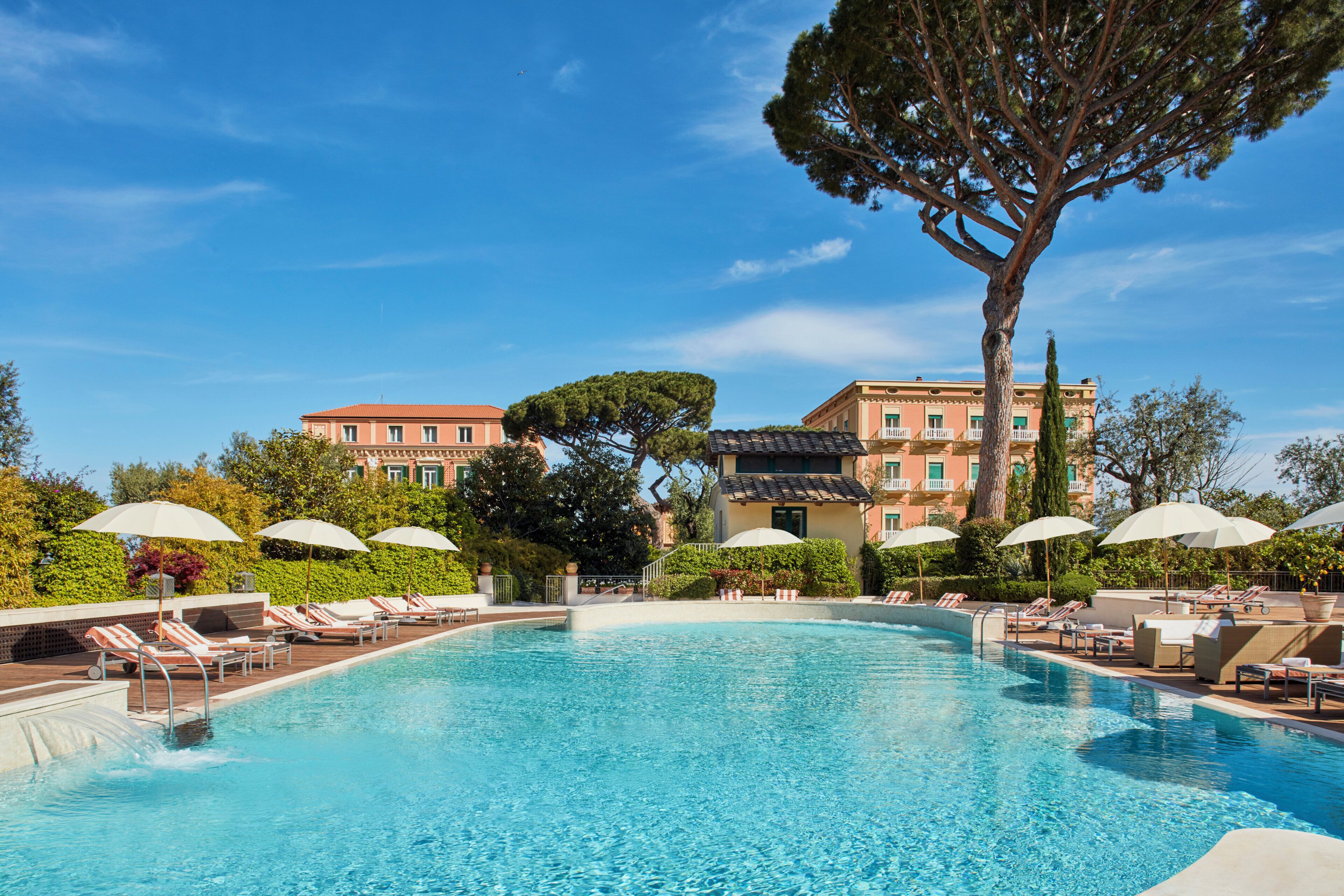 Seasonal outdoor pool, pool umbrellas, pool loungers