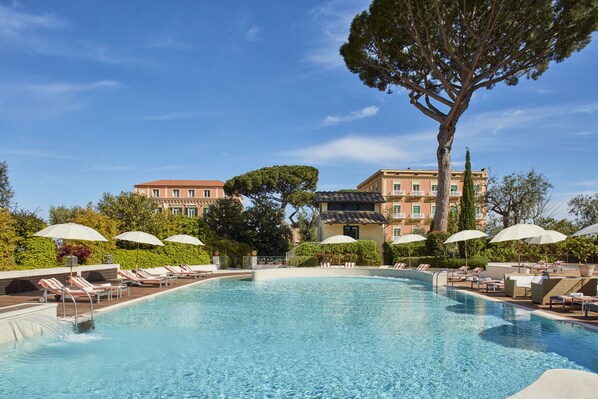 Seasonal outdoor pool, pool umbrellas, pool loungers