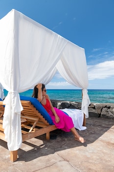Outdoor pool, cabanas (surcharge), pool umbrellas at Royal Kona Resort