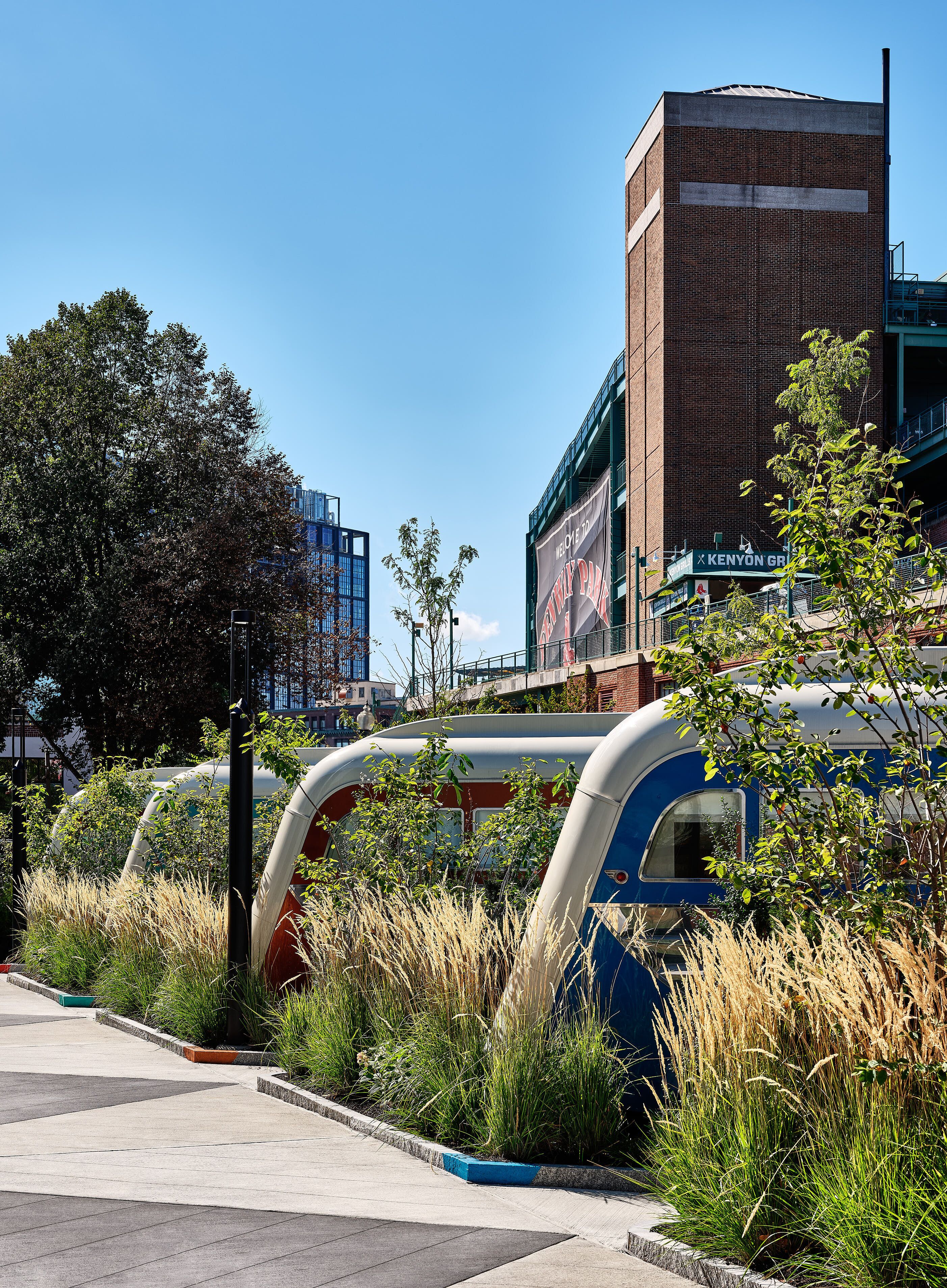 A modern building with a brick facade and a large billboard.