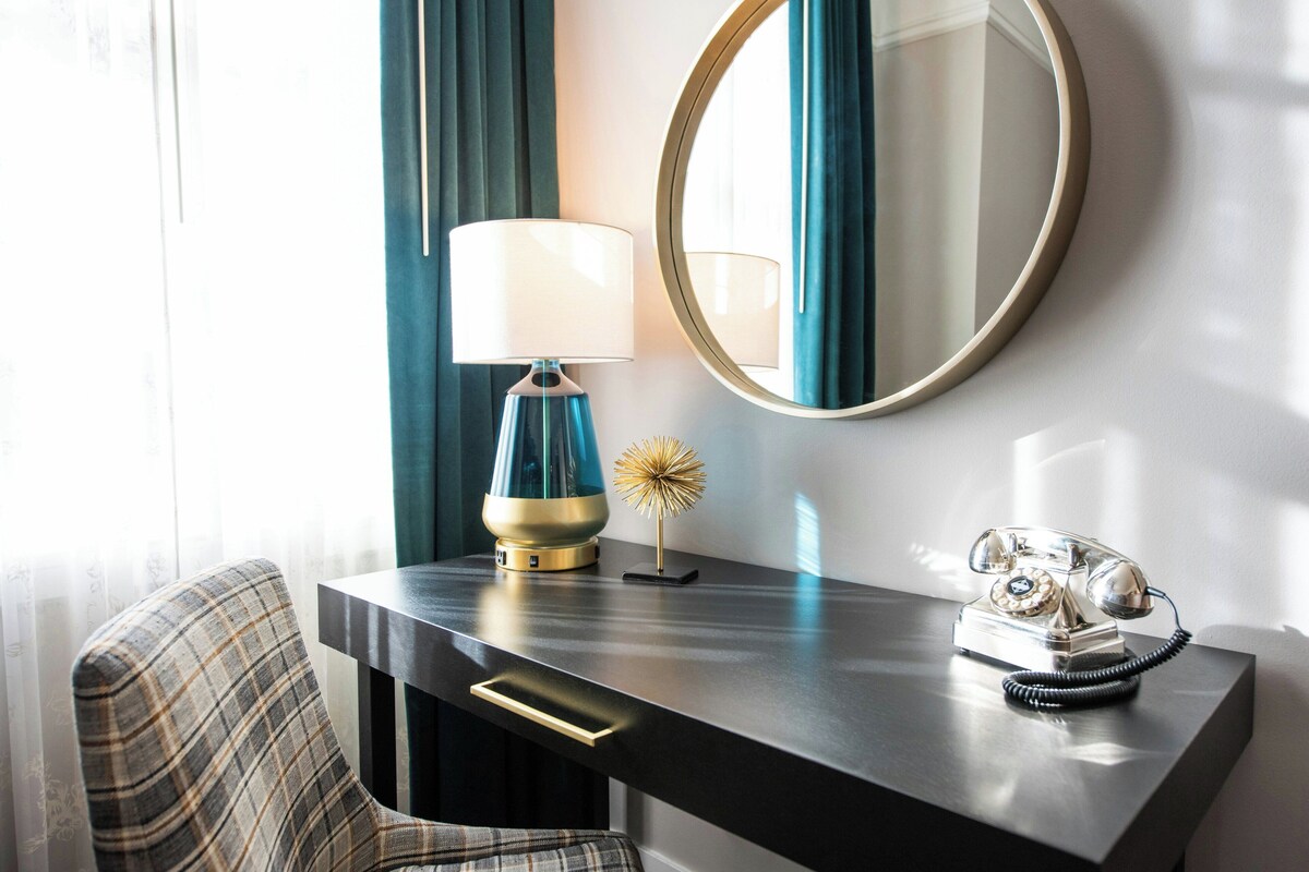 Premium bedding, laptop workspace, blackout drapes, iron/ironing board
