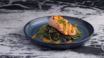 A plate of food on a marble surface.