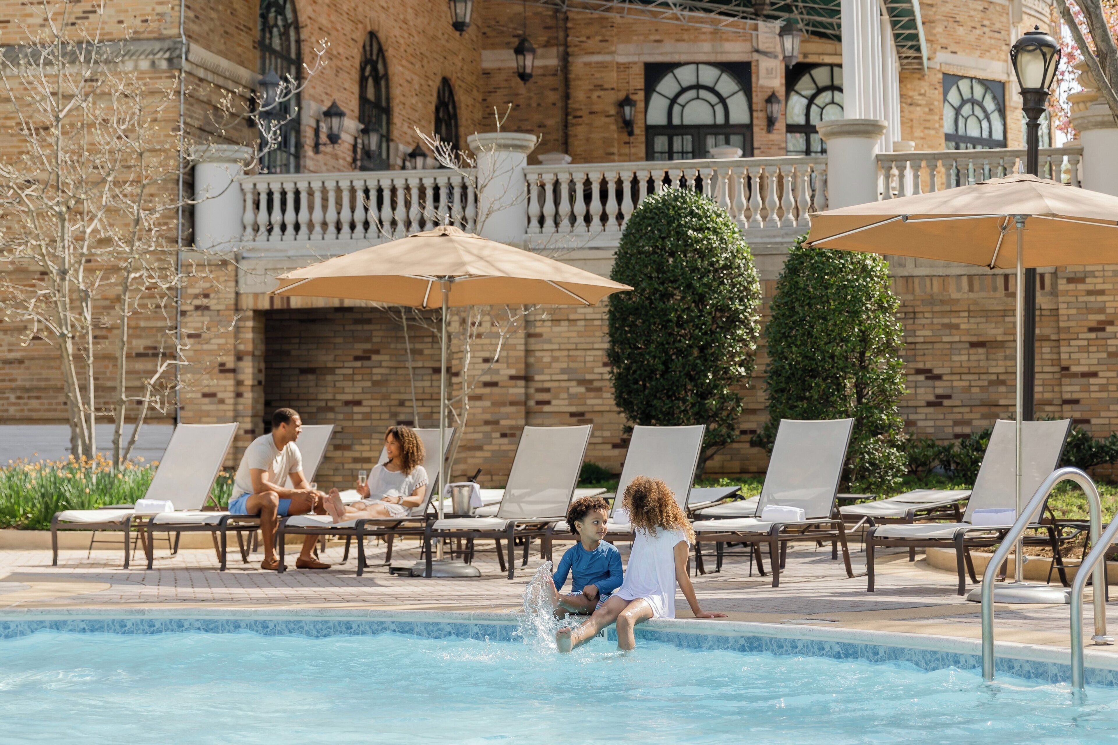 Outdoor pool, open 6:00 AM to 10:00 PM, pool umbrellas, pool loungers