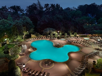 Outdoor pool, open 6:00 AM to 10:00 PM, pool umbrellas, sun loungers at Omni Shoreham Hotel