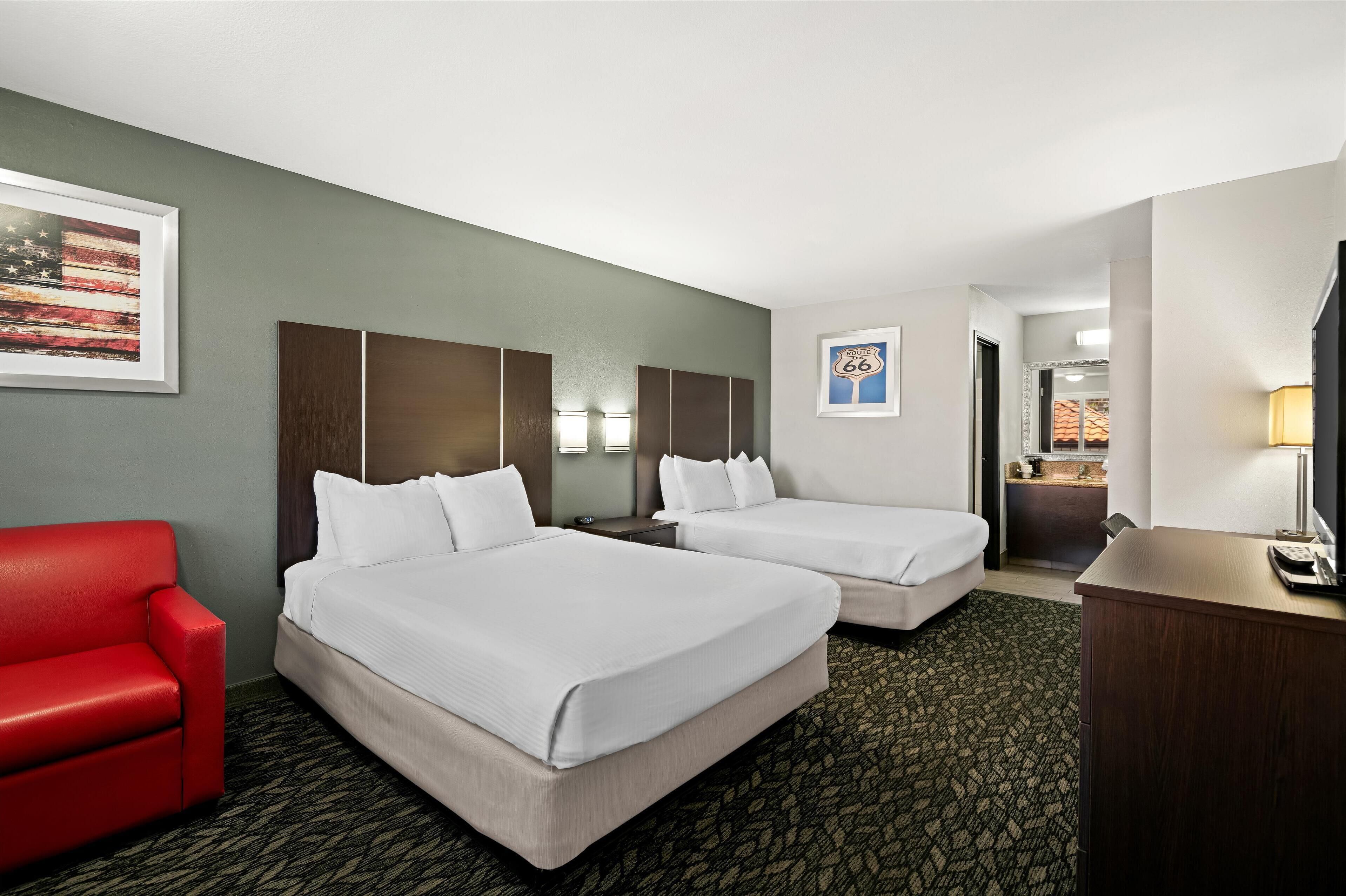 standard room, 2 queen beds, non smoking, refrigerator & microwave | pillow-top beds, desk, iron/ironing board, free wifi