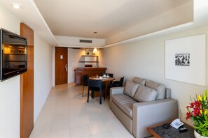 Luxury Suite, 1 Queen Bed | Living room | 32-inch LCD TV with cable channels, TV