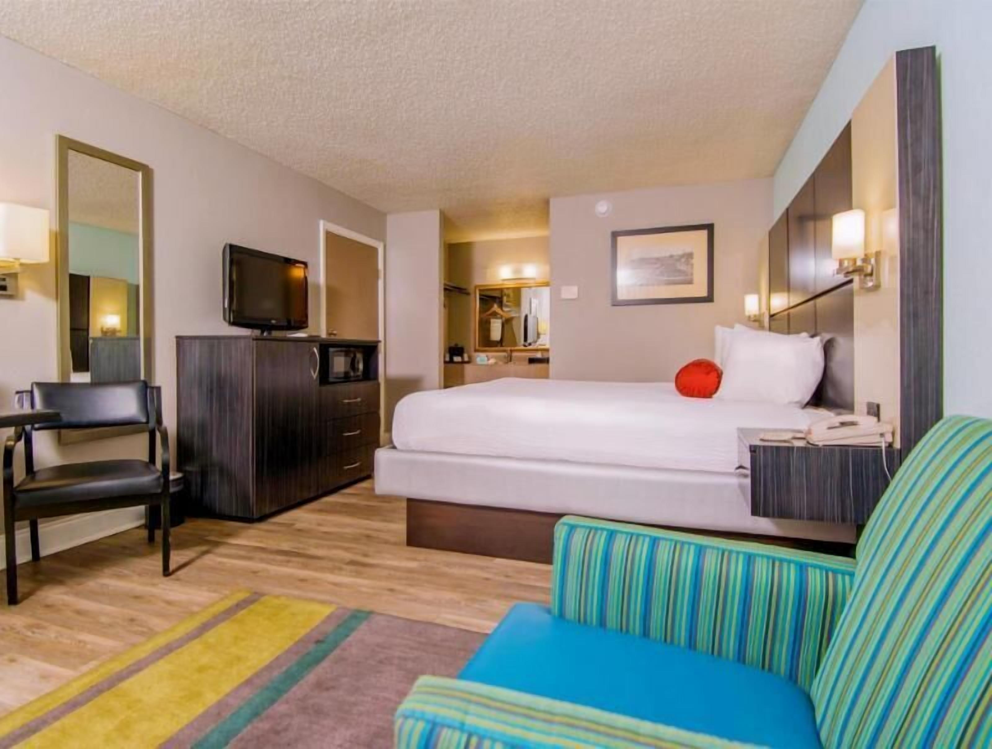 Premium bedding, laptop workspace, blackout curtains, iron/ironing board