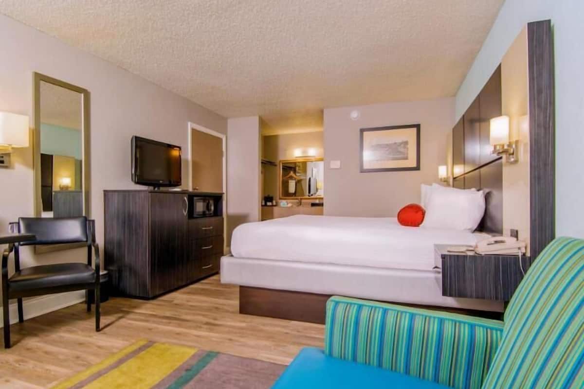 Premium bedding, laptop workspace, blackout curtains, iron/ironing board