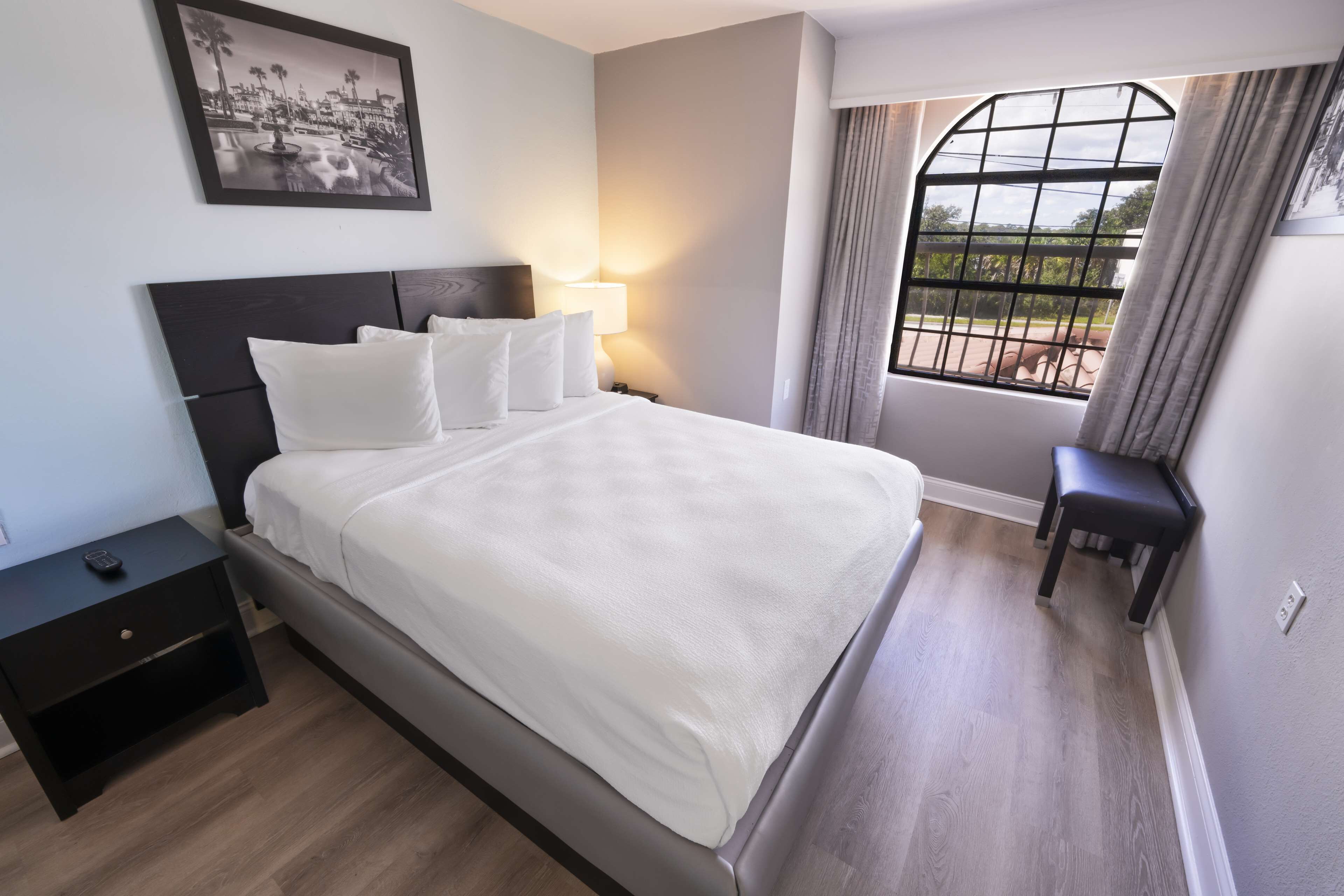 premium bedding, laptop workspace, blackout curtains, iron/ironing board