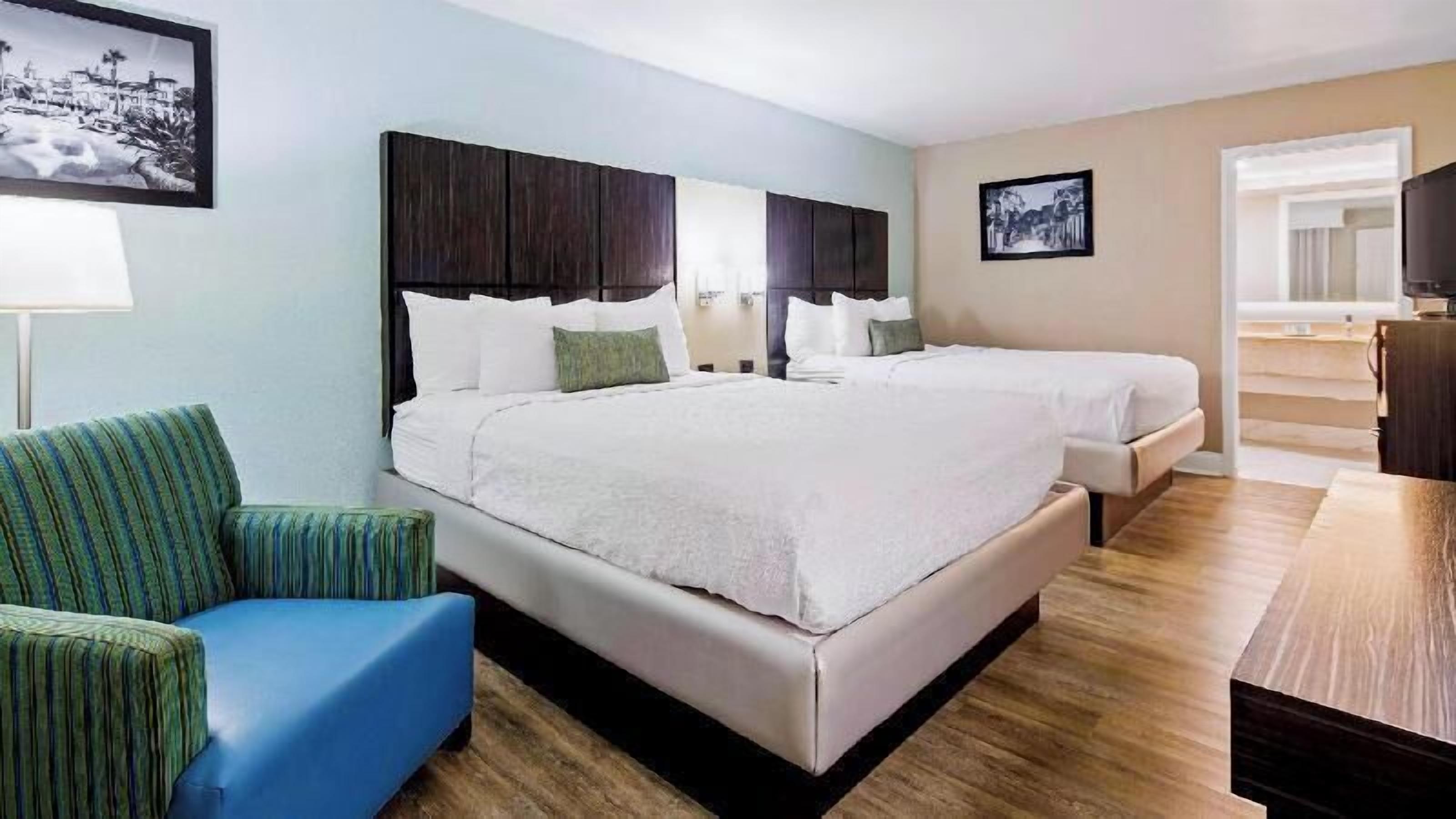 Premium bedding, laptop workspace, blackout curtains, iron/ironing board