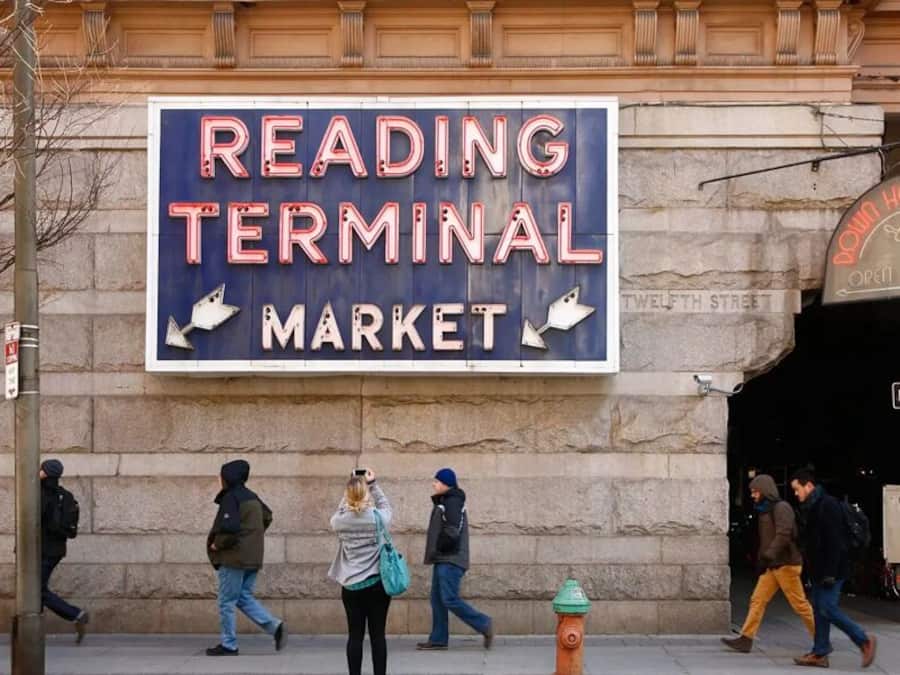 A building with a large sign reading "READING TERMINAL MARKET".