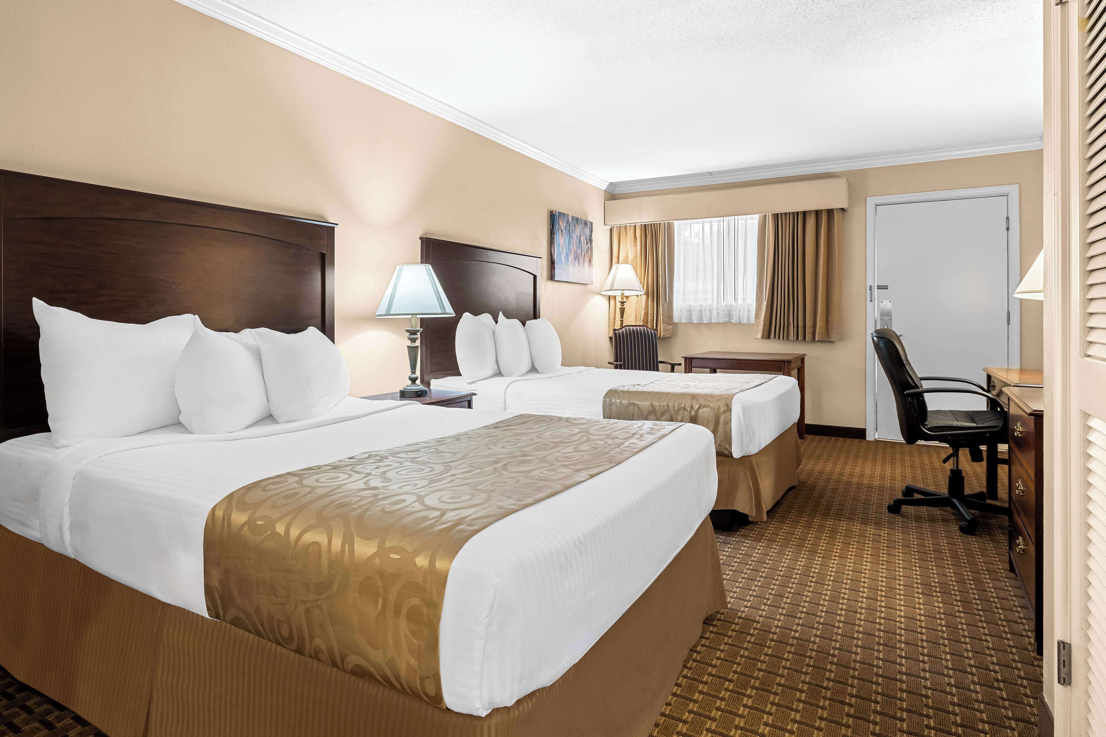 desk, laptop workspace, blackout curtains, iron/ironing board