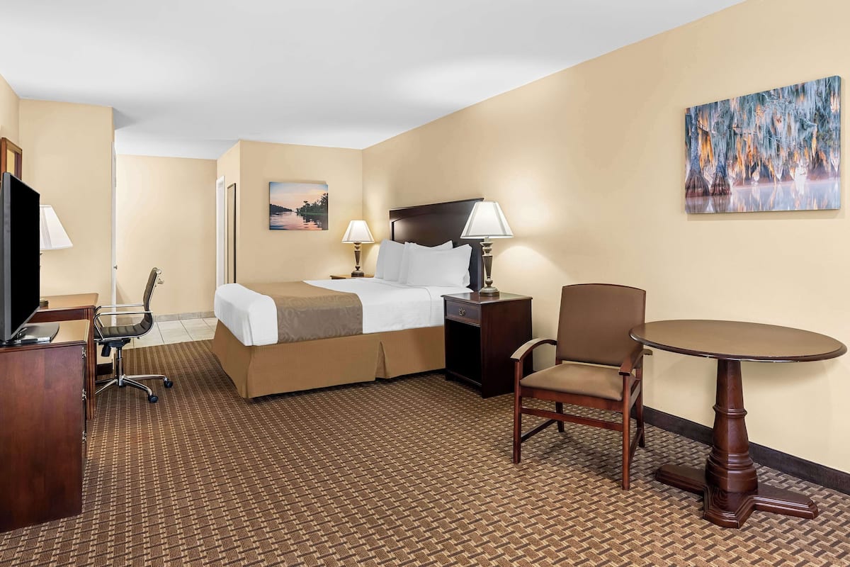 Suite, 1 King Bed, Accessible, Refrigerator & Microwave | Desk, laptop workspace, blackout drapes, iron/ironing board