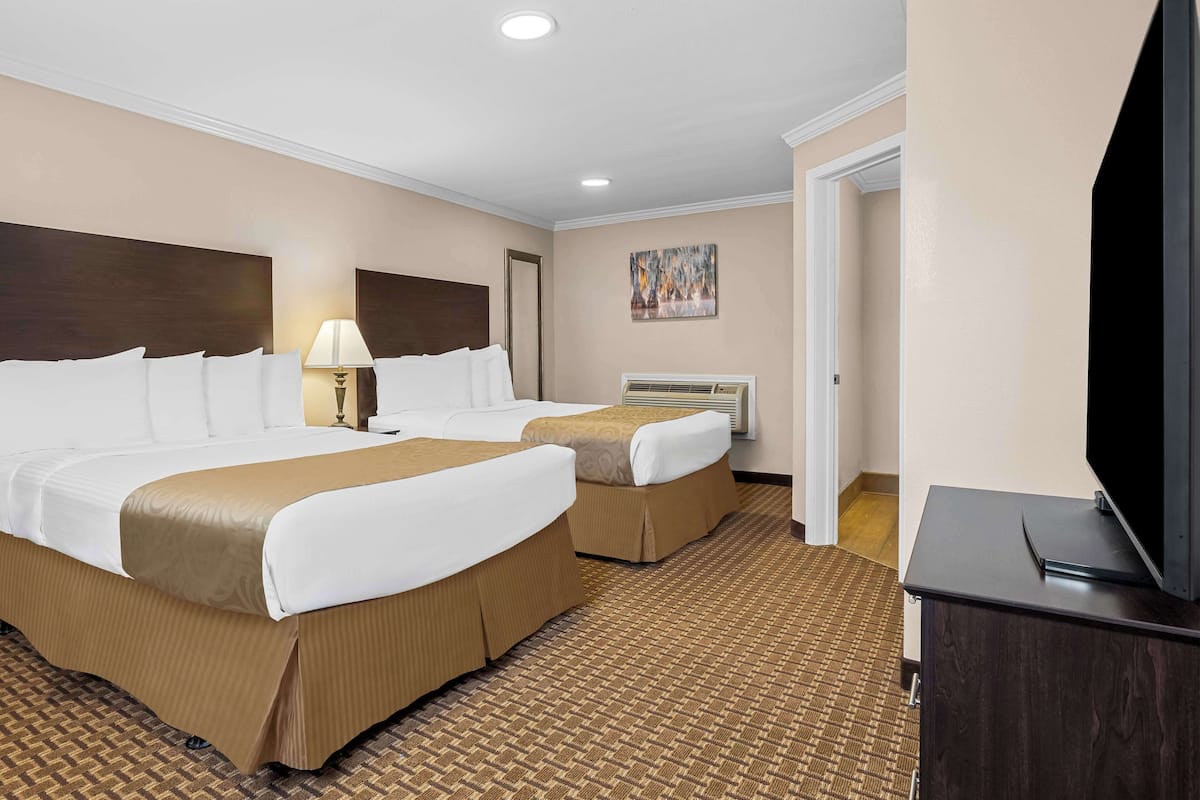 Suite, 2 Queen Beds, Non Smoking, Jetted Tub | Desk, laptop workspace, blackout drapes, iron/ironing board
