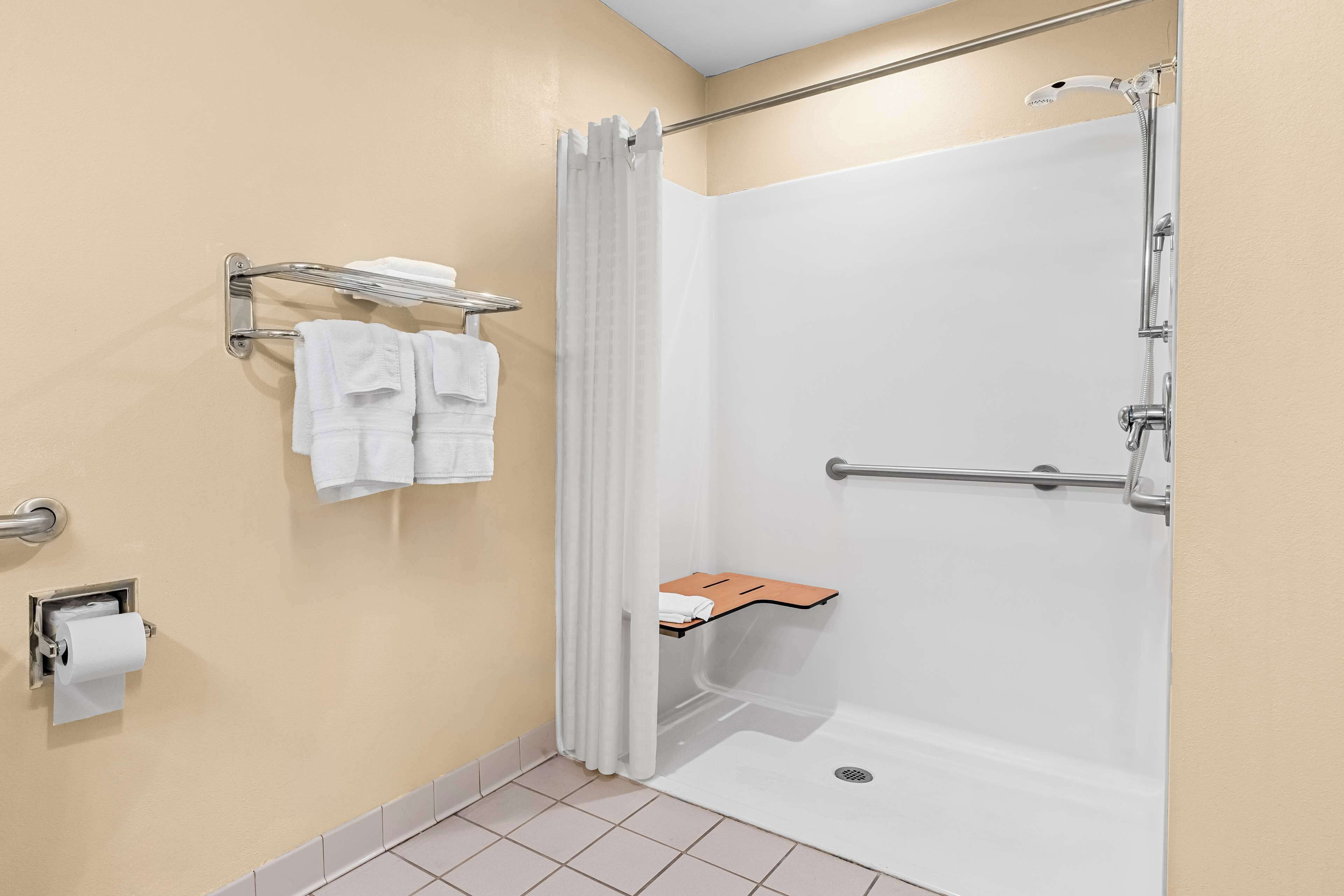 suite, 1 king bed, accessible, refrigerator & microwave | bathroom | combined shower/bathtub, hydromassage showerhead, free toiletries