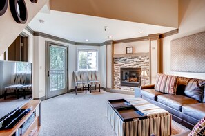 Premier Condo, 3 Bedrooms | Living room | Flat-screen TV