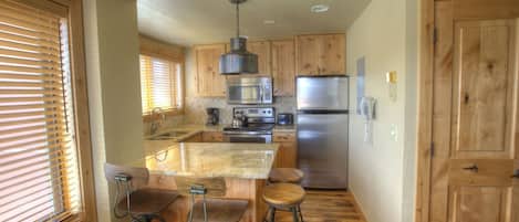 Premier Studio (Condominium) | Private kitchen | Fridge, microwave, oven, stovetop