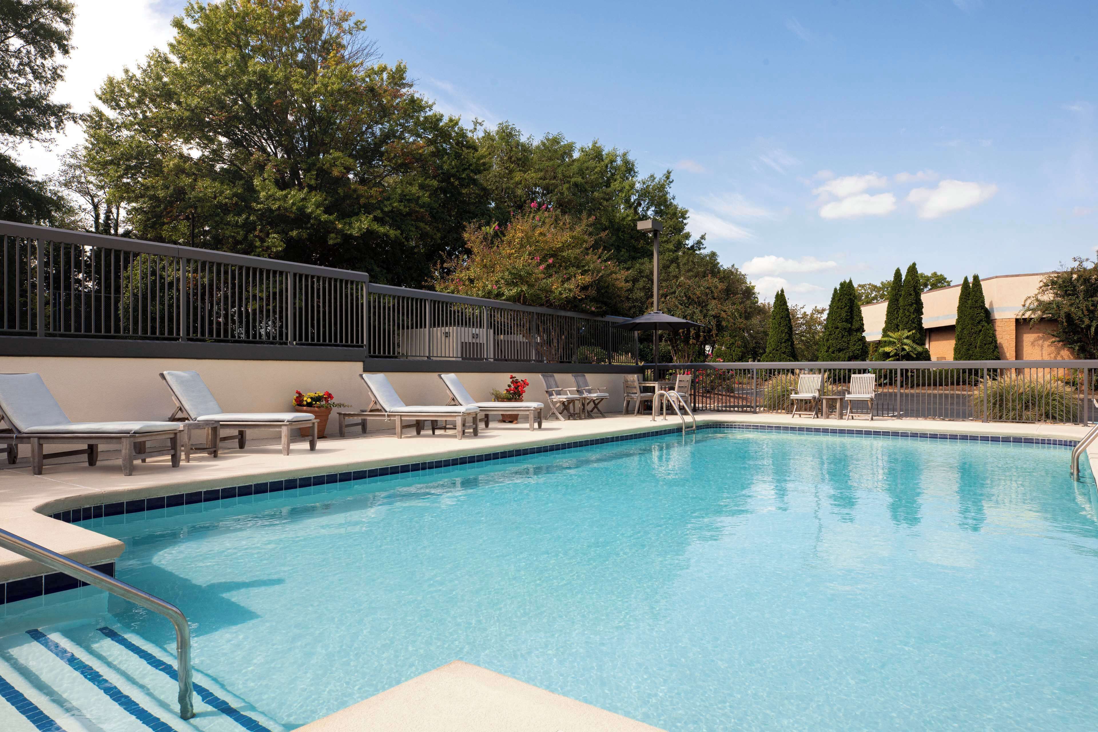 seasonal outdoor pool, open 8:00 am to 10:00 pm, pool umbrellas