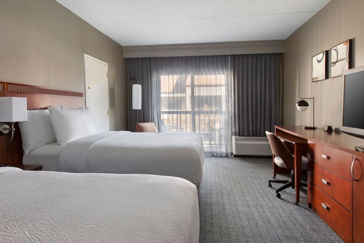 Premium bedding, pillowtop beds, desk, laptop workspace