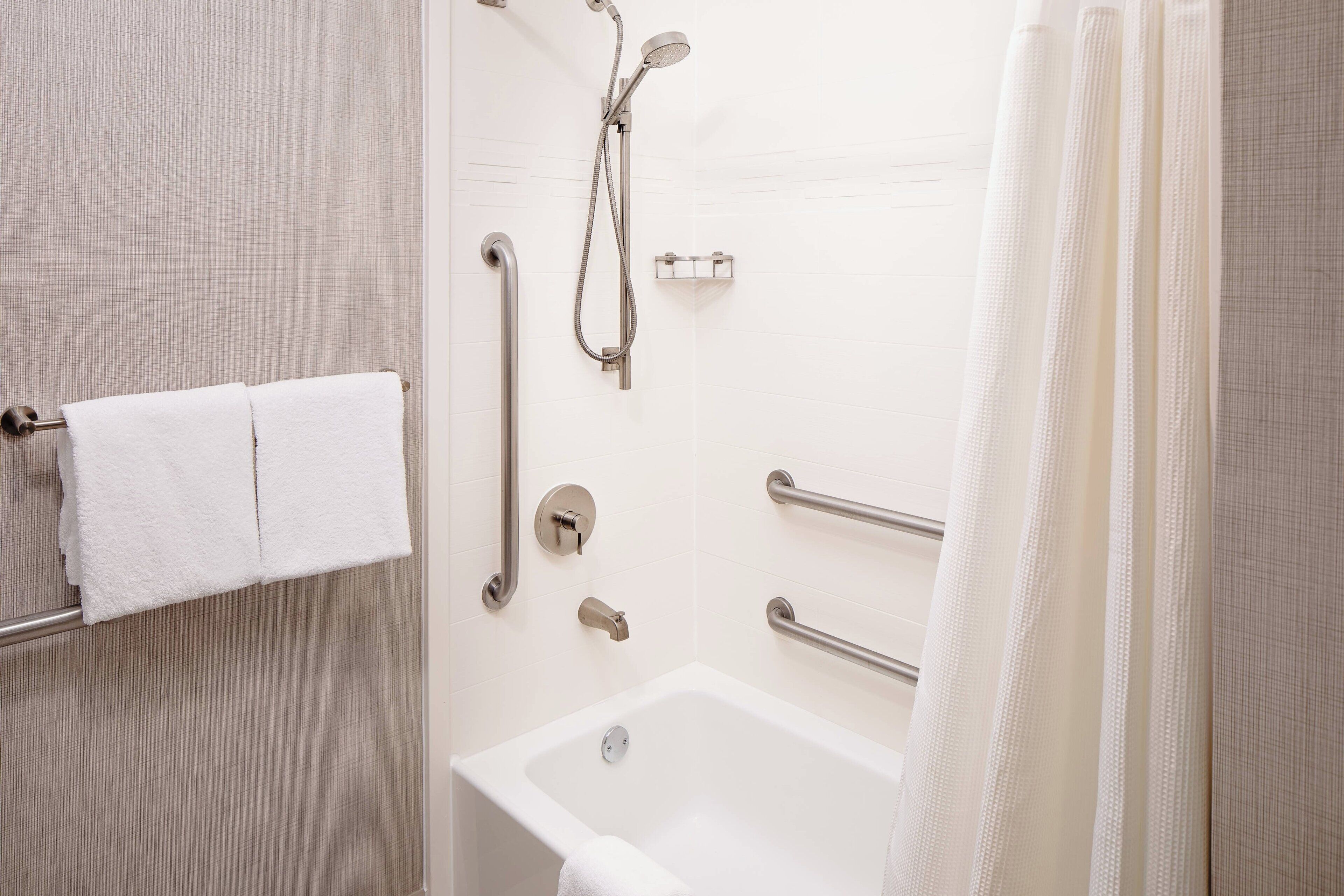 combined shower/bathtub, free toiletries, hair dryer, towels