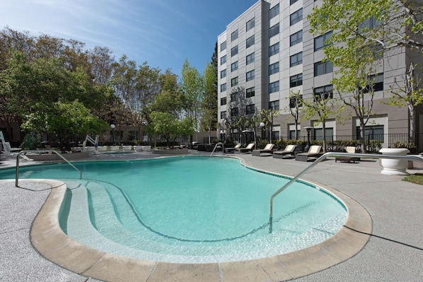 Outdoor pool, open 9:00 AM to 10:00 PM, pool loungers